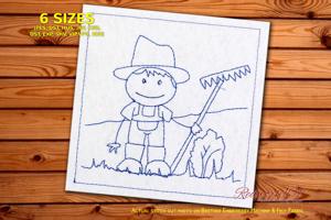 Farmer boy holding rake in field